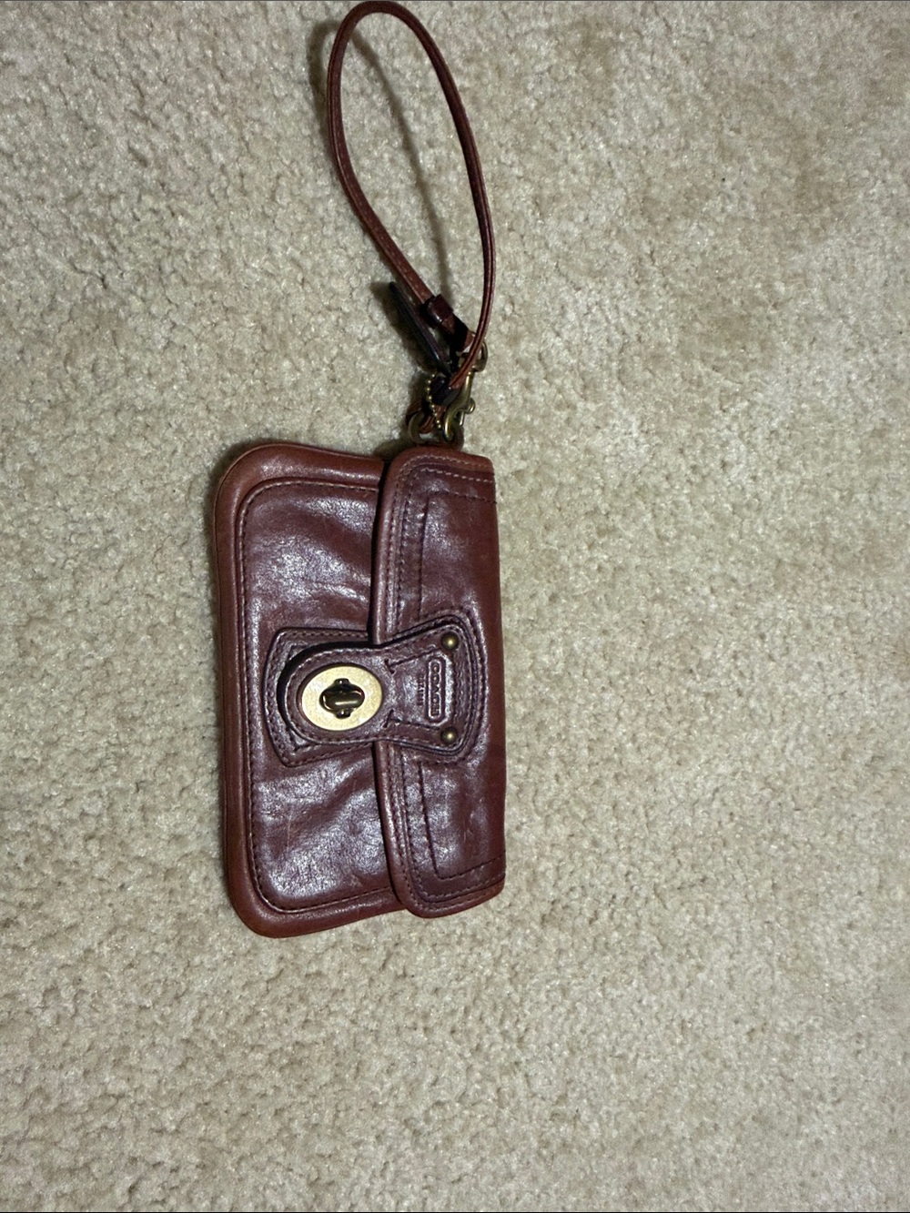 Coach Leather Turn-Lock Wristlet Phone Case in Brown